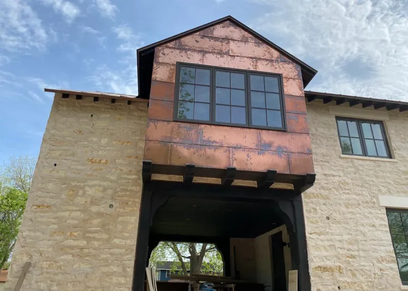 Copper metal panel facade on a stone building for Skylight Installation in Monroeville